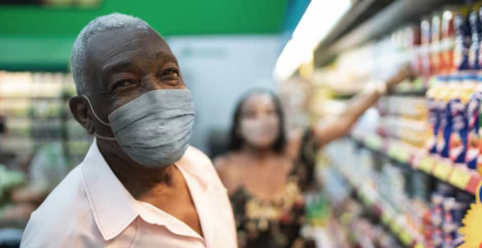 Family at grocery store in masks