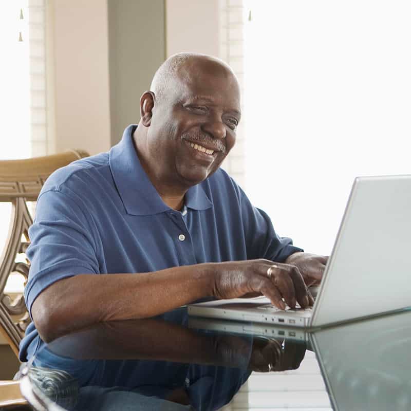 Man logging into MyChart on laptop